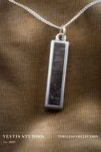 Raptor Fossil Necklace – Plated Silver