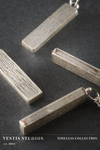 Raptor Fossil Necklace – Plated Silver